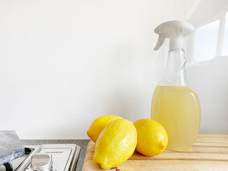 Vinegar and lemon cleaning solution in a spray bottle